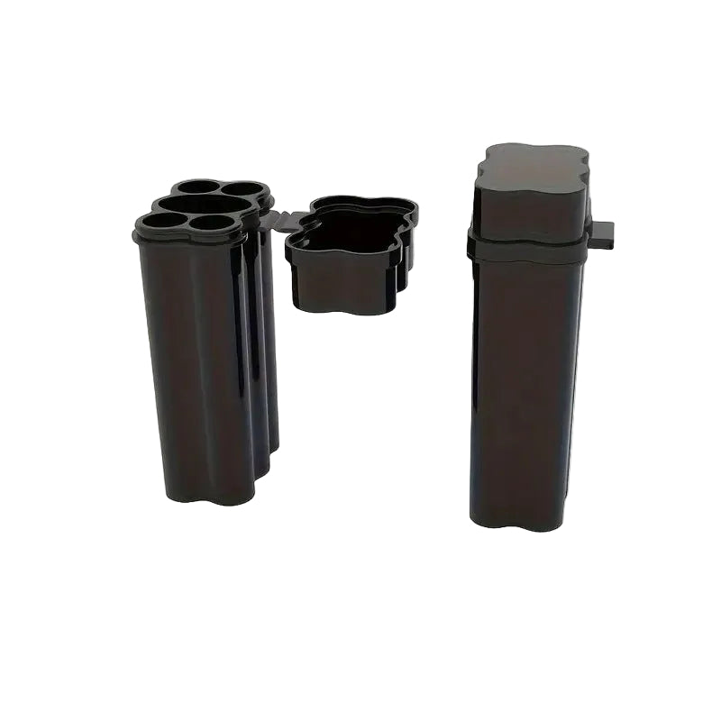 Set of black plastic components on a white background