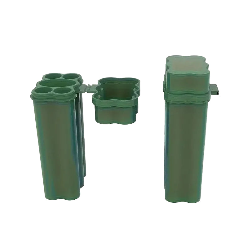 Green plastic container with multiple compartments on a white background